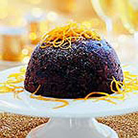 Exotic Christmas Pudding with Orange Sauce