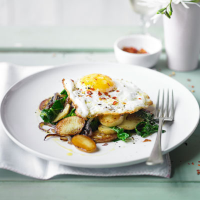 New potatoes and spring greens with chilli-fried duck eggs