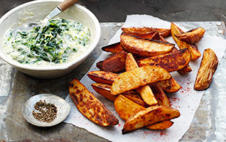 Spiced wedges with cheesy baby leaf greens