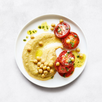 essential Waitrose fried tomatoes on chick pea purée