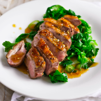 Glazed duck breast with braised greens_image