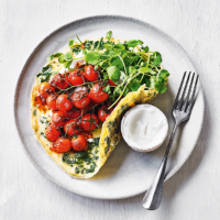 Herb omelette with harissa-roasted tomatoes 