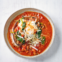 Italian vegetable soup with poached eggs & bread