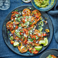 Loaded sweet potatoes with lime crema, black beans & guacamole