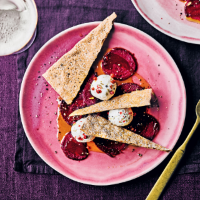 Marinated goat’s cheese with pink peppercorns, beetroot & crispbreads