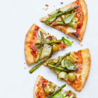 Pizza with courgettes, asparagus, olives and mozzarella
