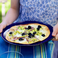 Tortilla pizza with courgettes, olives and mozzarella