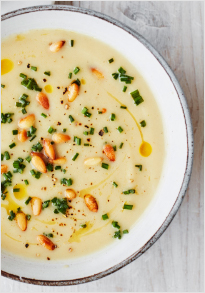 Celeriac and roasted garlic soup with chives and pine nuts