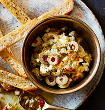 Baked feta dip with olives, truffle & artichokes
