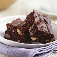 Chocolate brownies with pears and brazil nuts