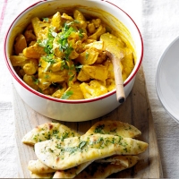 Potato & cauliflower curry with garlic naan wedges