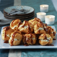 Toffee profiteroles with pineapple and basil cream