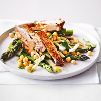 Warm salad of seared harissa chicken with fennel, asparagus & chickpeas
