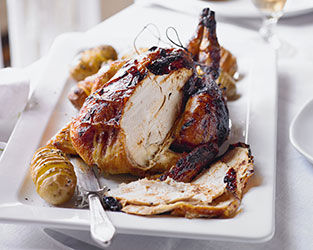 Ginger glazed roast chicken with hasselback potatoes