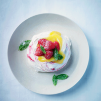 Donna Hay's raspberry swirl pavlova with vanilla bean cream & passion fruit
