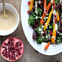 Food To Glow rainbow carrots & flower sprouts with roasted garlic & tahini drizzle
