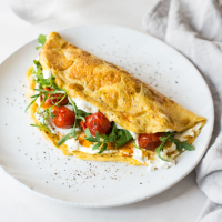 Garlic & herb omelette with roasted tomatoes