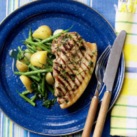 Pork chops with potato, spinach and green beans