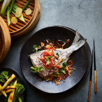 Steamed sea bream with sizzled ginger, garlic & chillies